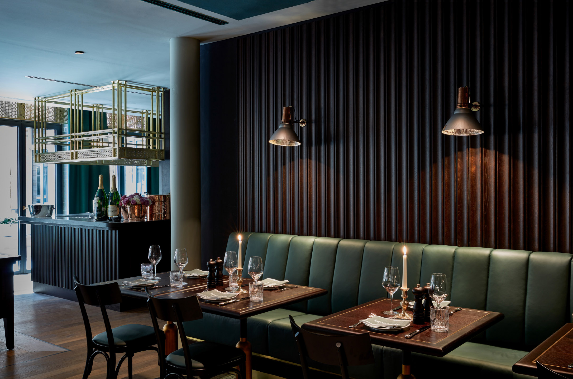 Panelled lounge with low seating and hung work