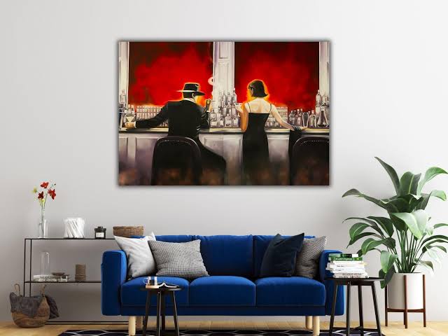 Hotel lounge with tall windows and a hung canvas