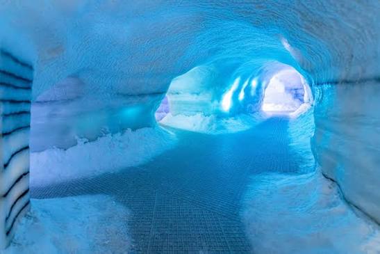 Carved hall of snow and ice lit from within